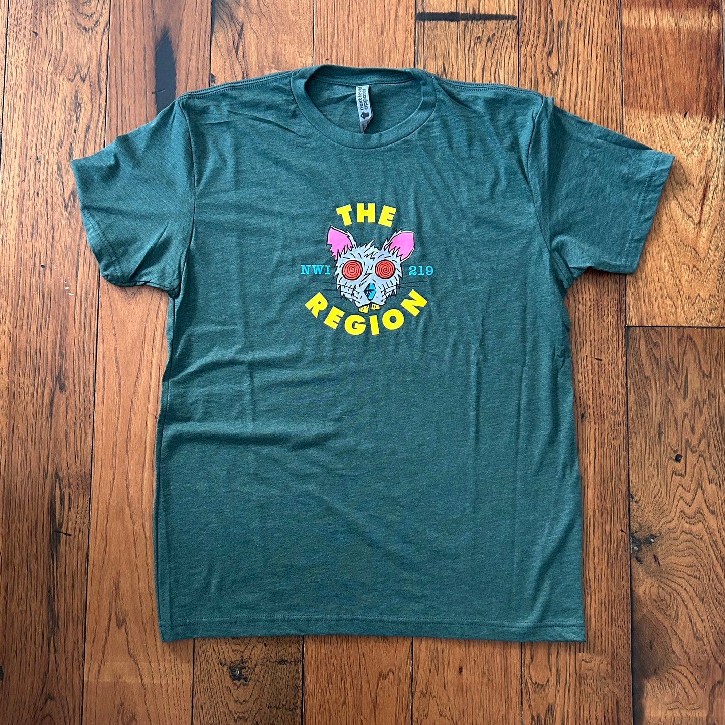 Region Rat t-shirt Green short sleeve shirt with colorful rat a on wood floor
