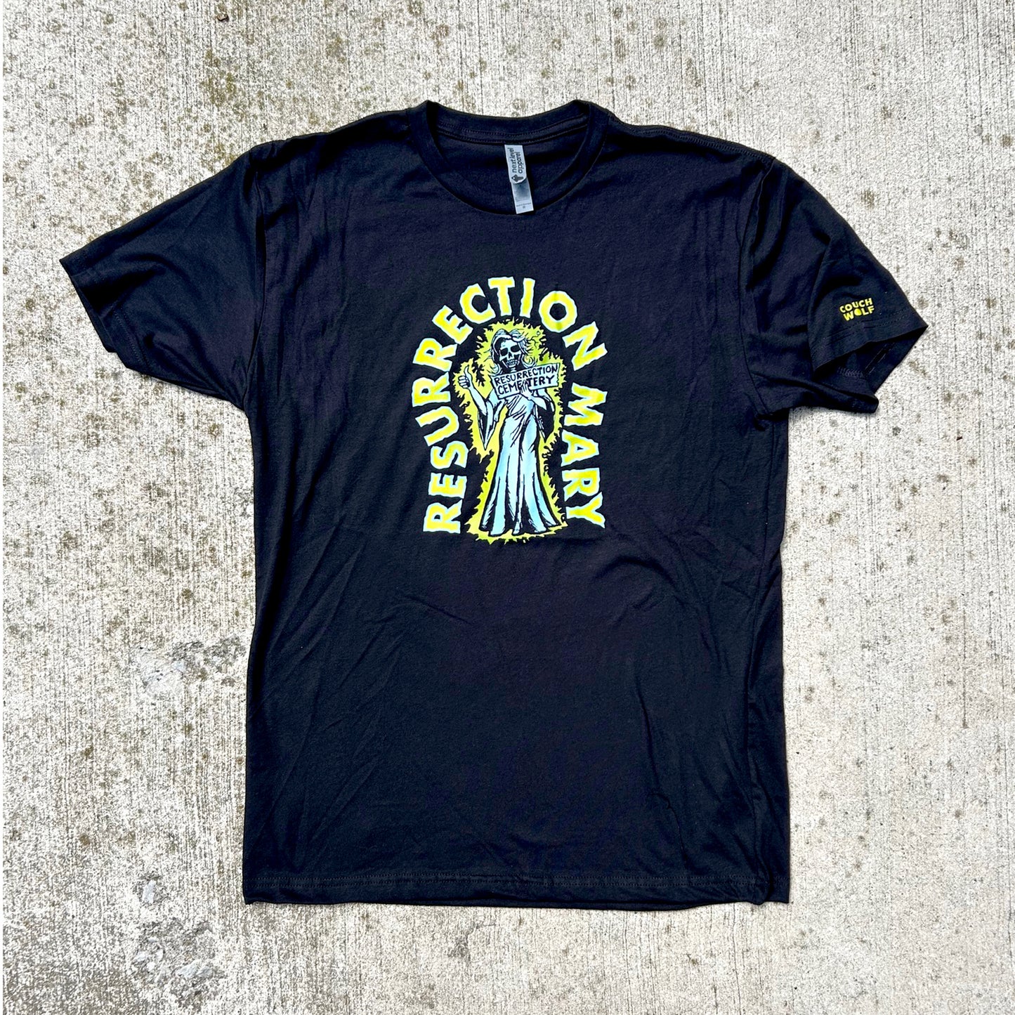 Black t-shirt with 'Resurrection Mary' graphic on a textured surface