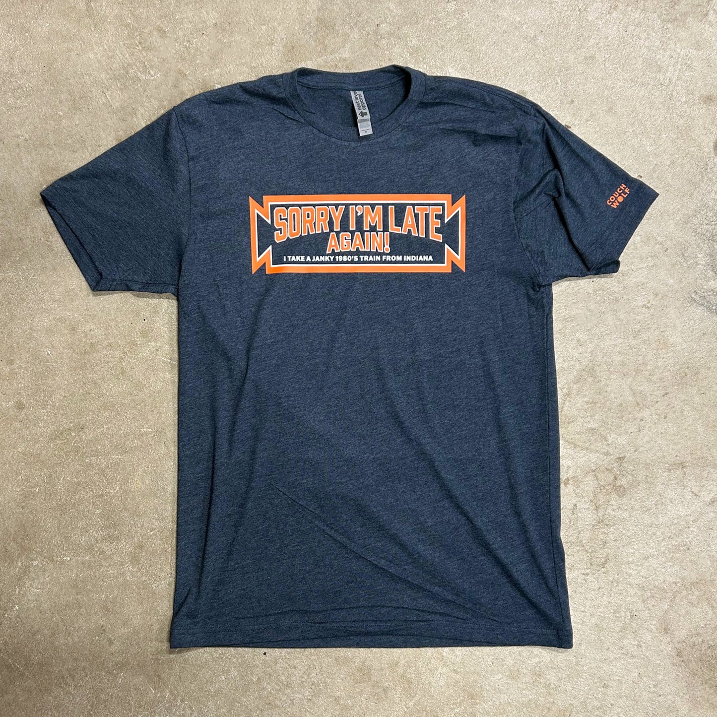 Blue south shore line parody t-shirt with orange text on a beige surface