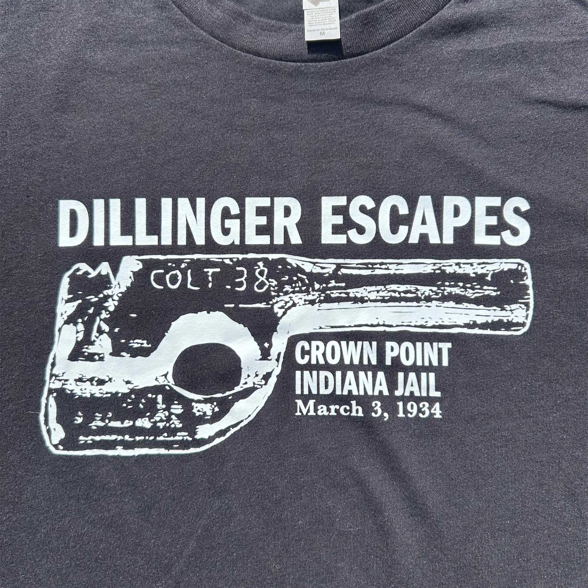 Dillinger Escapes design says Dillinger Escapes Crown Point Indiana Jail March 3, 1934 black fabric with white ink
