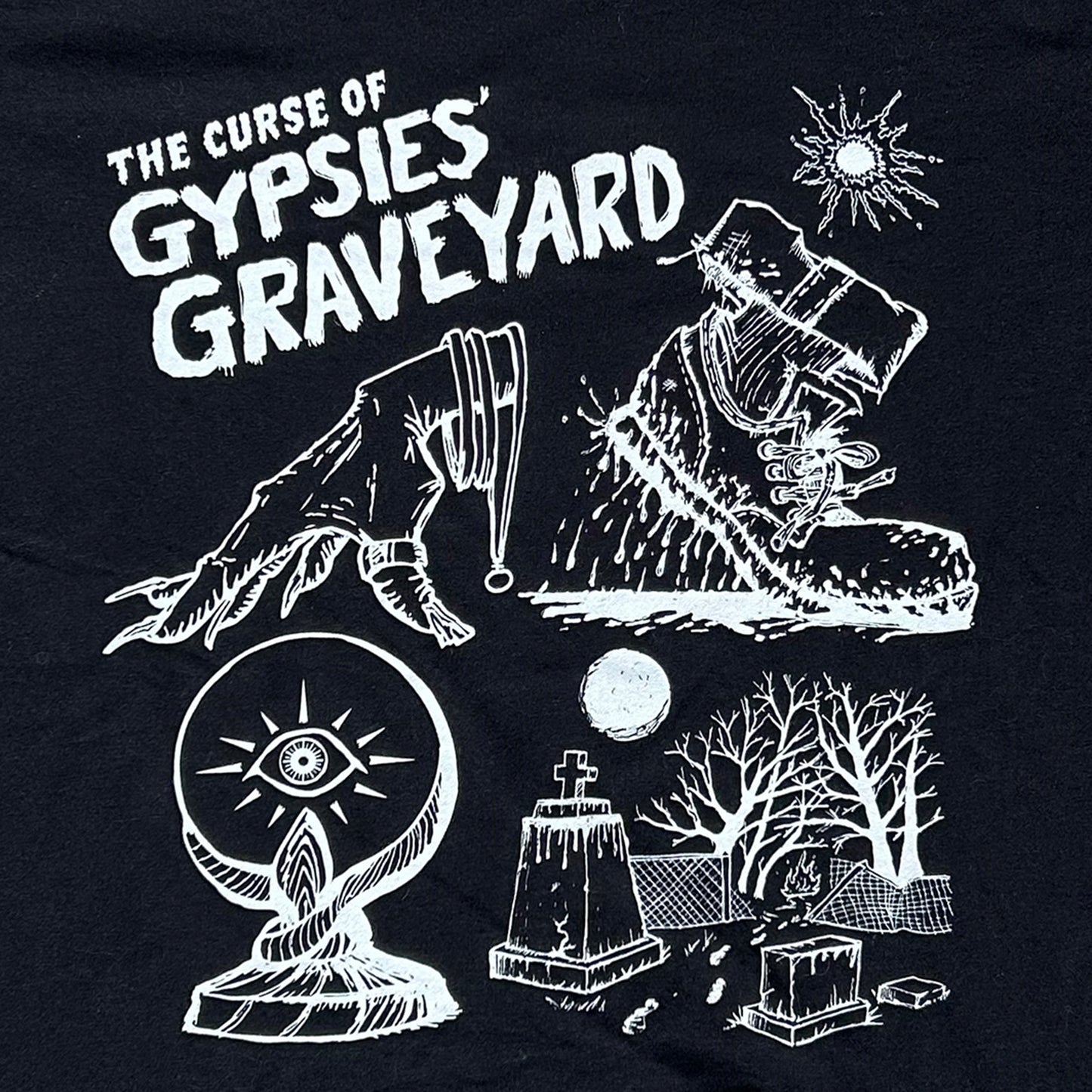 Gypsies Graveyard Indiana paranormal ghost shirt black shirt features white ink art of hand over crystal ball, blood soaked shoe and graveyard with destroyed fence says "the curse of gypsies graveyard"