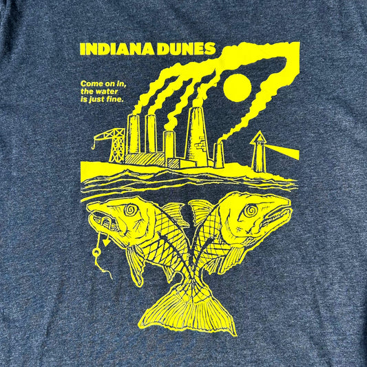 Blue t-shirt with yellow graphic of a factory and fish, featuring text 'INDIANA DUNES' and 'Come on in, the water is just fine'.