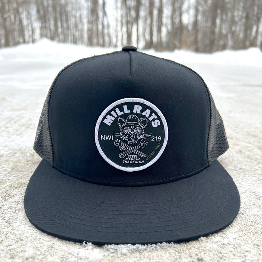 Black trucker hat with mill rats logo patch on a snowy ground