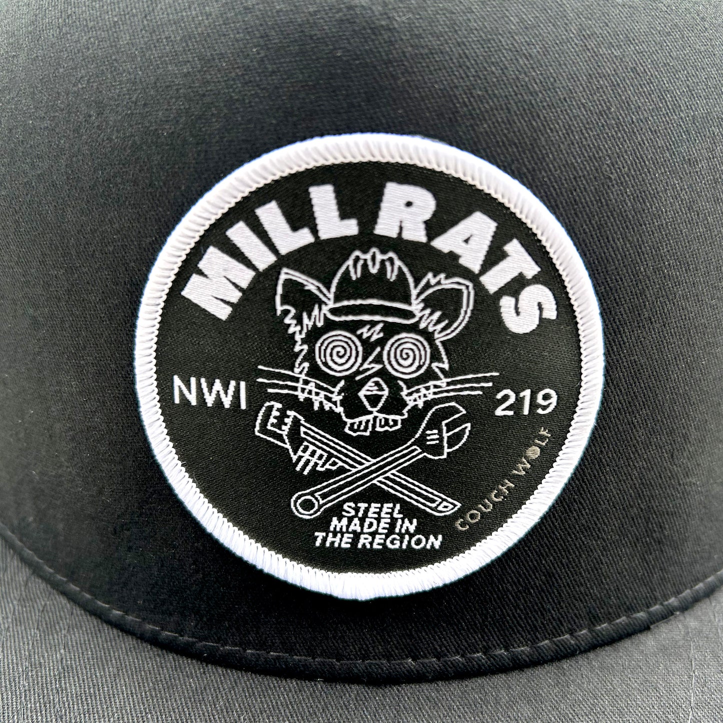 Black  'MILL RATS' logo patch and text on a gray background