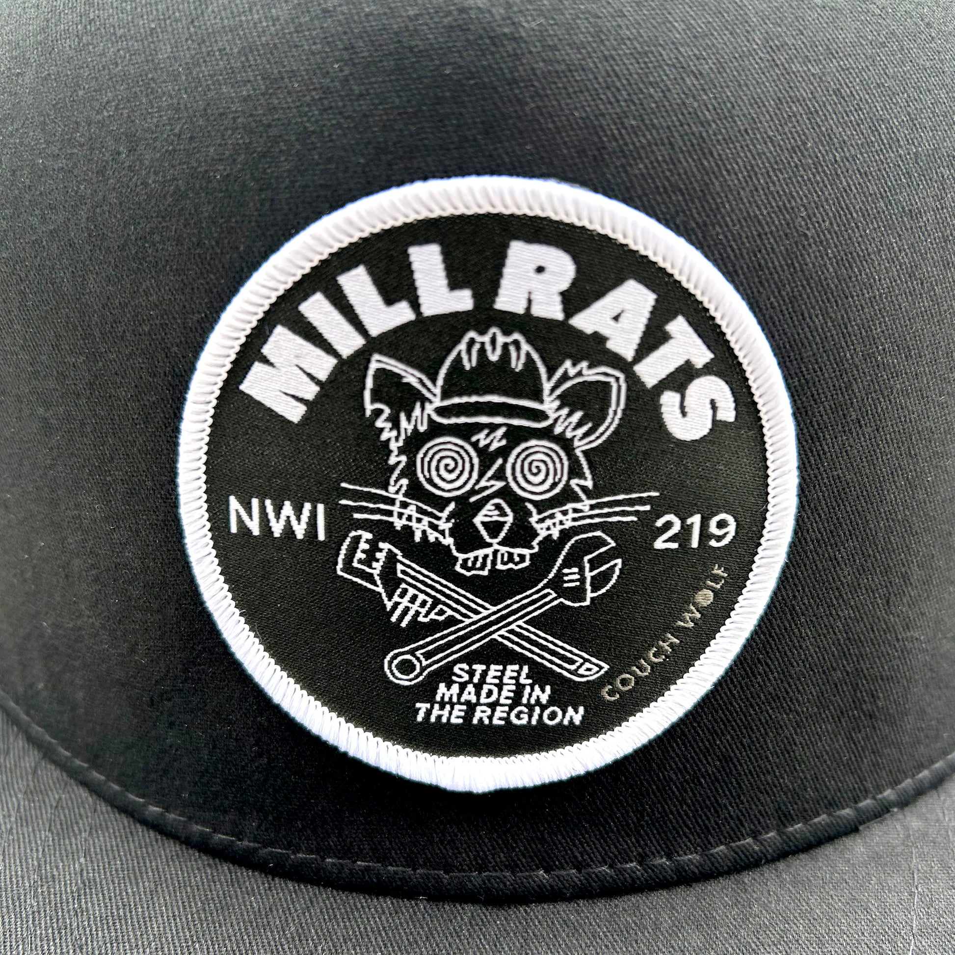 Black  'MILL RATS' logo patch and text on a gray background
