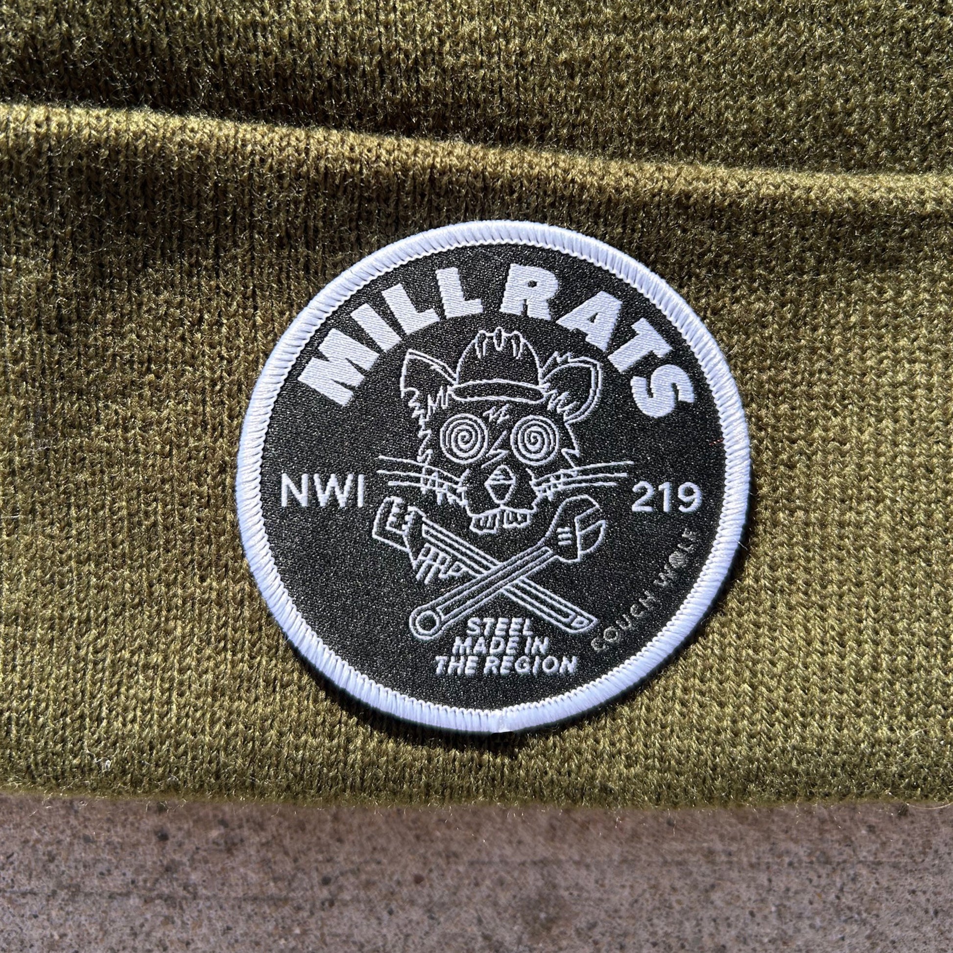 Patch with 'Mill Rats NWI 219' design on a green fabric background