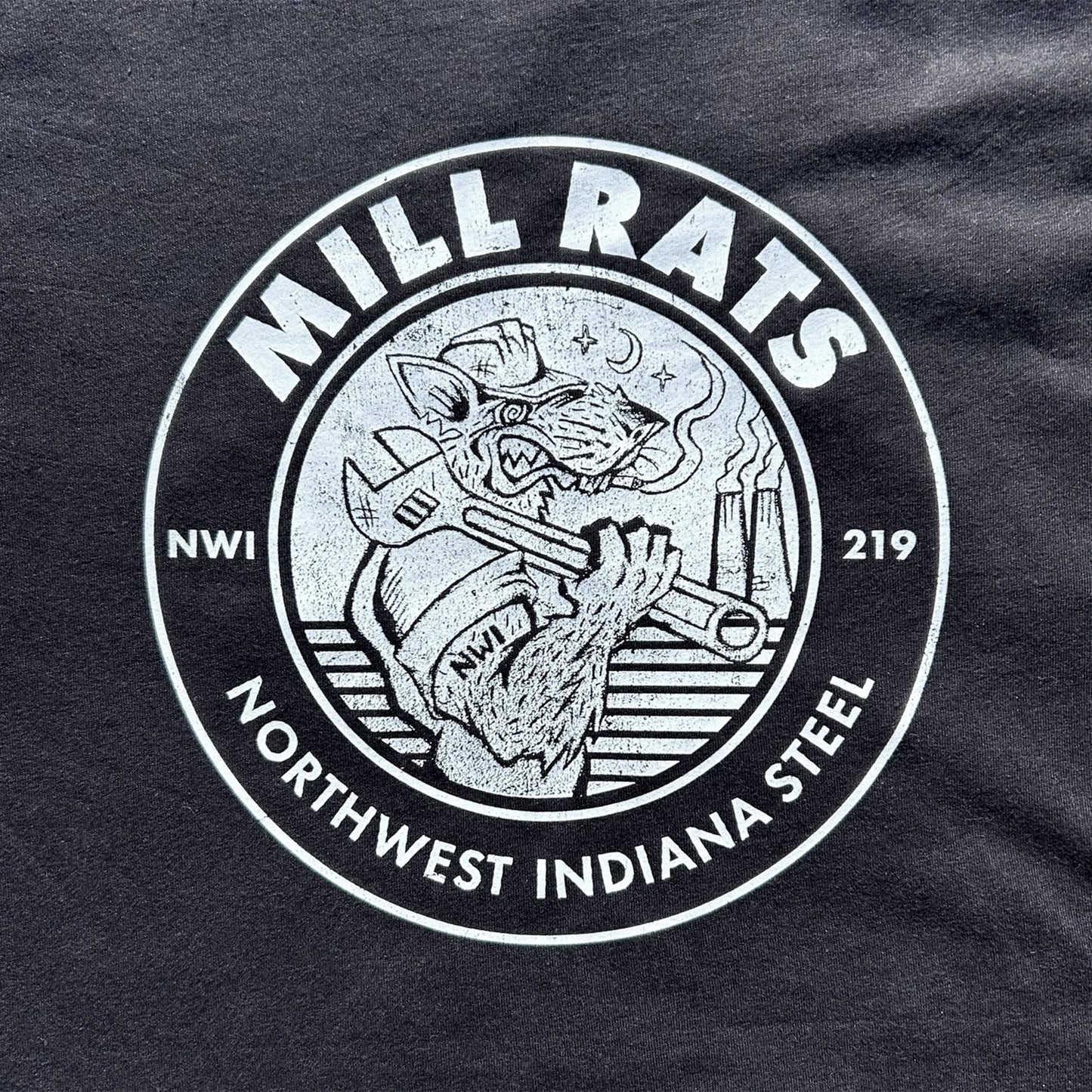 Black t-shirt with 'Mill Rats' logo featuring a graphic of a rat holding a wrench on a dark background.