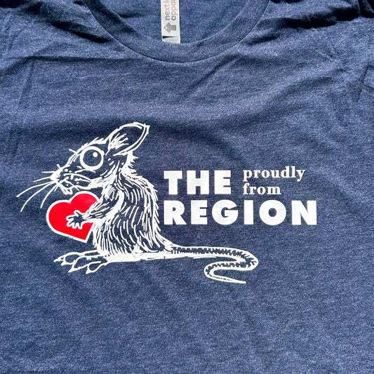 Blue t-shirt with a graphic of a rat holding a heart and text 'THE REGION proudly from', on a blue background.