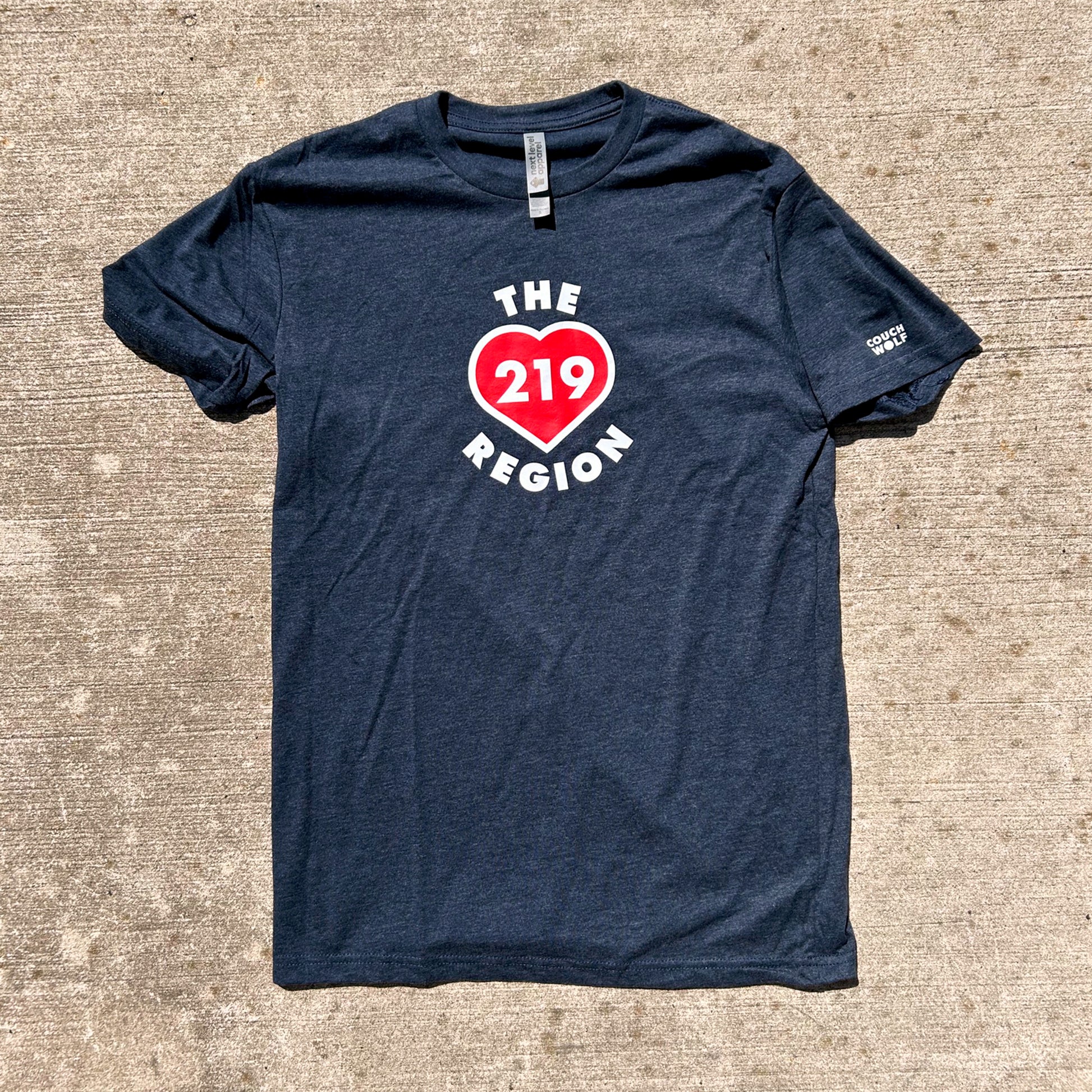 Navy blue t-shirt with a red heart and white text on a textured surface