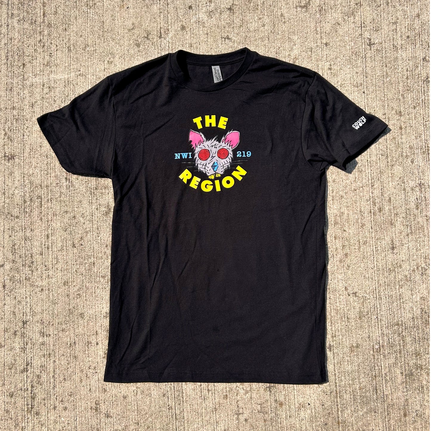 Black t-shirt with a graphic region rat design on a textured beige surface