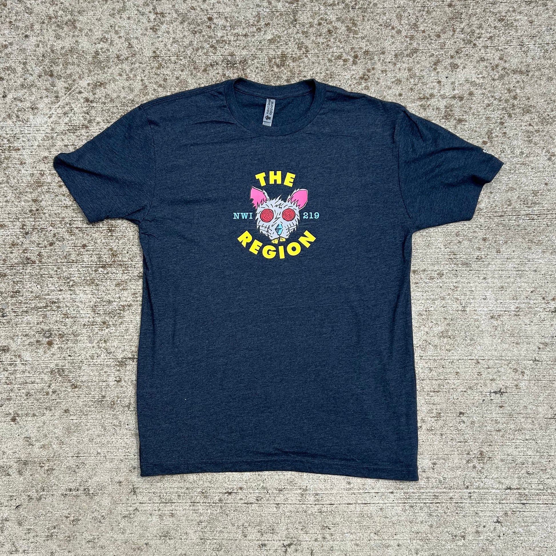 Navy Region Rat T-shirt with rat artwork that says "The Region NWI 219" shown on textured tan concrete background 